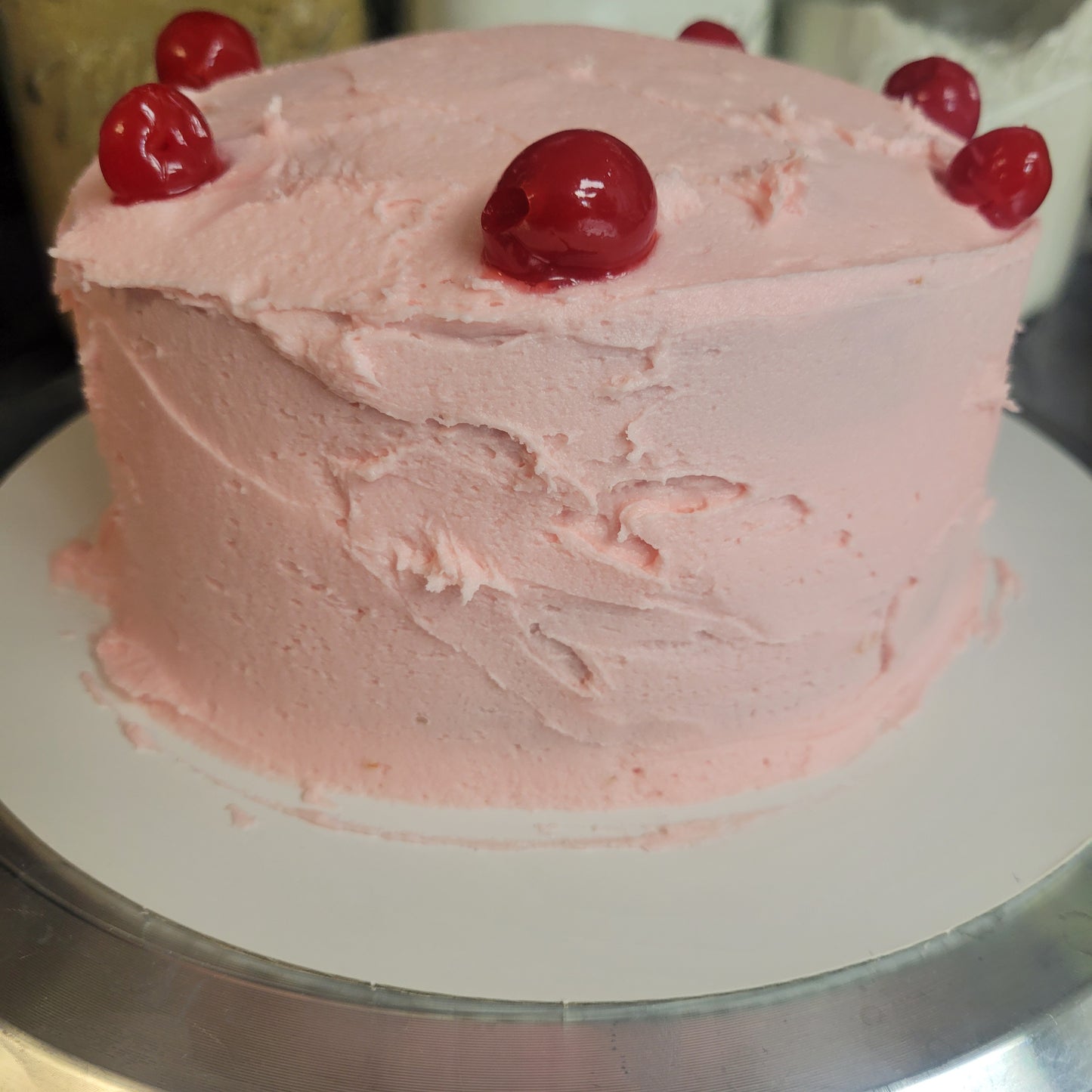1 Cherry chip cake with cherry frosting 9 inch round double layer serves 10 people
