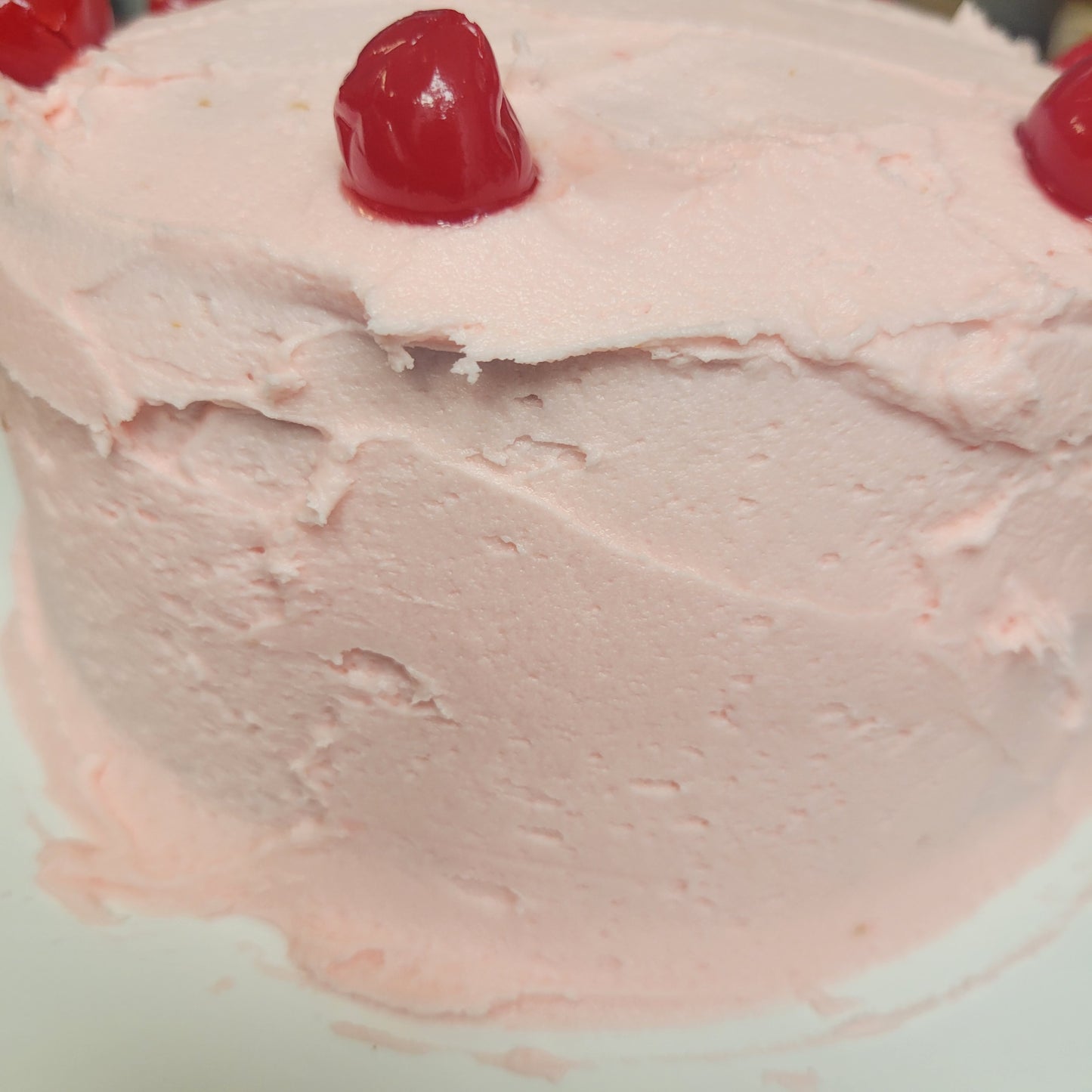 1 Cherry chip cake with cherry frosting 9 inch round double layer serves 10 people